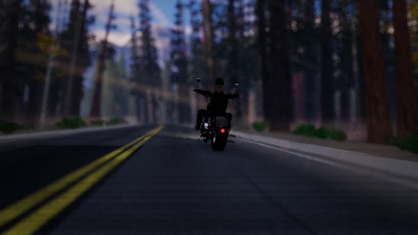 Sonnet’s Ghost Road: a chopper and rider on a wooded mountain highway.